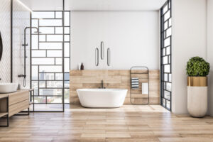 front-view-modern-interior-design-light-bathroom-with-city-view-from-stylish-windows-white-bath-wooden-floor-sink-base-cabinet-black-shower-green-tree-floor-vase-3d-rendering
