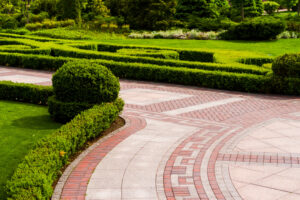 stone-tile-walkway-with-green-bushes-landscape-design